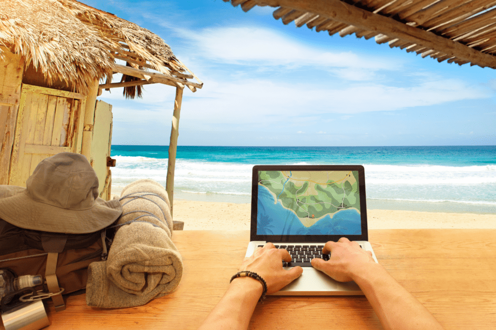 digital-nomad-working-on-beach-on-laptop