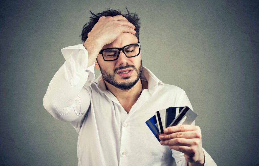 man regretting credit card mistakes