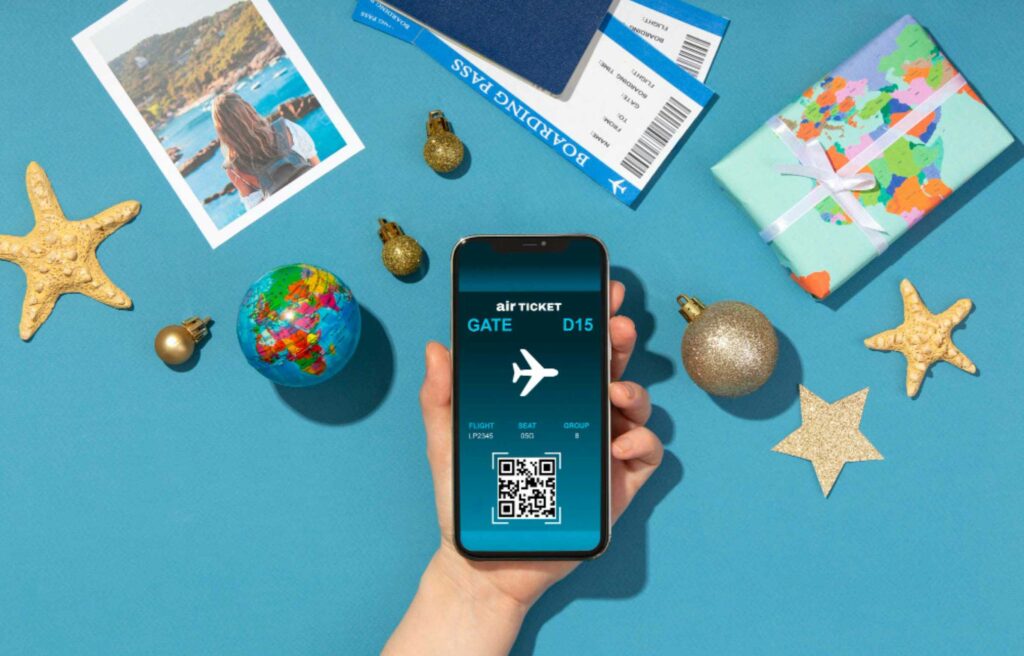 Hand holding a smartphone with a digital boarding pass, highlighting the need to book flights in advance for smooth travel planning.