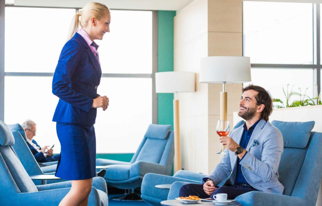 Customer having a drink in Priority Pass or LoungeKey Lounge