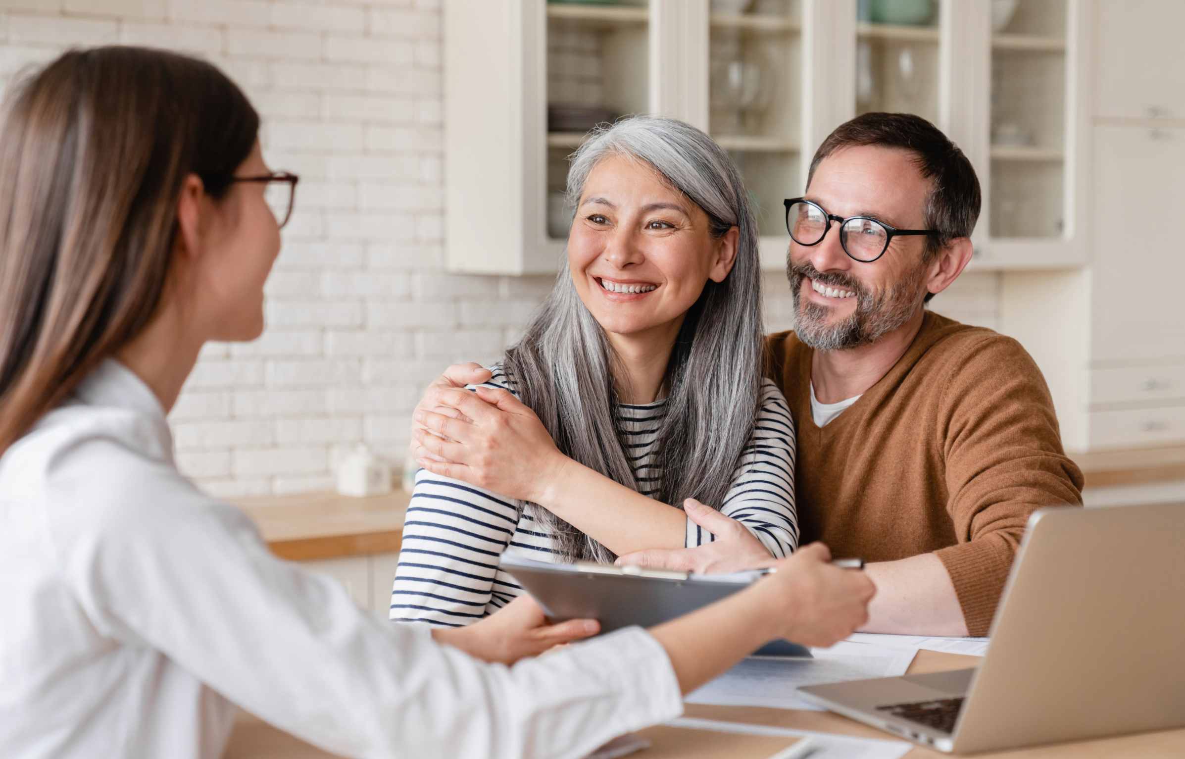 couple taking the benefits of financial adviror in a counseling session