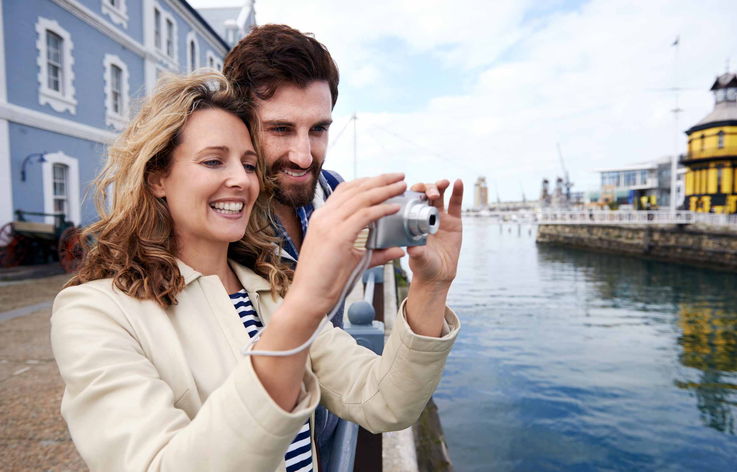 couple enjoying golden visa and capturing moment with camera