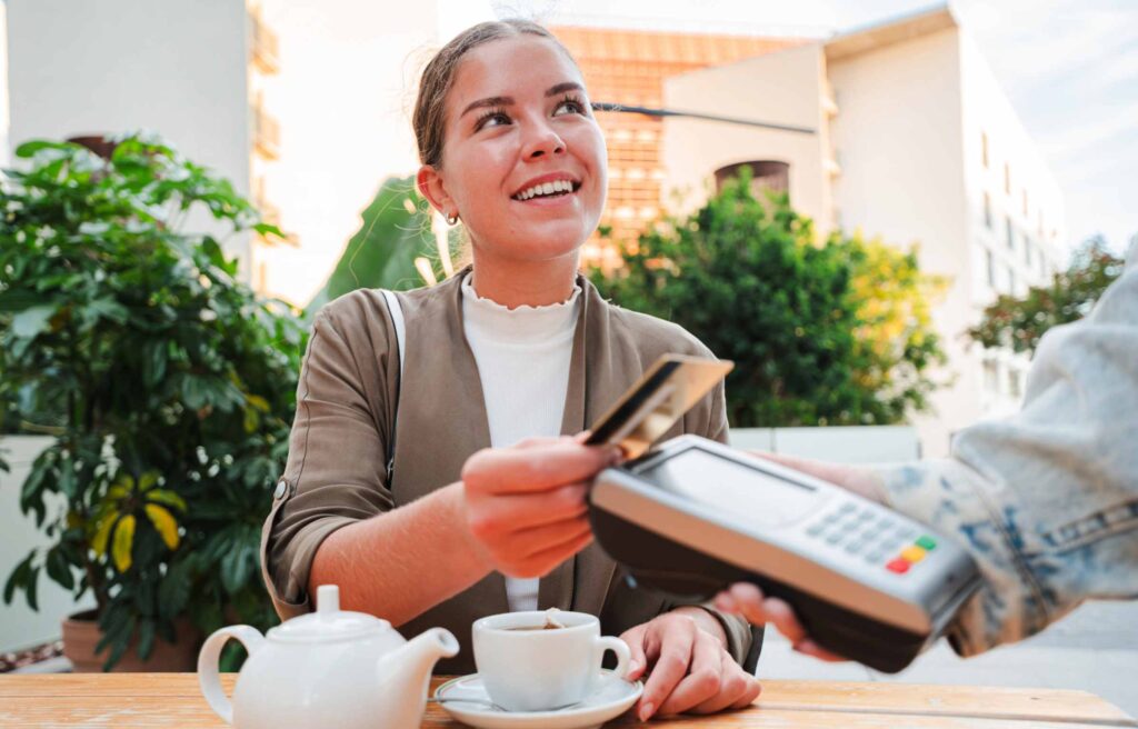 Cute Women Paying Bill From Credit Card