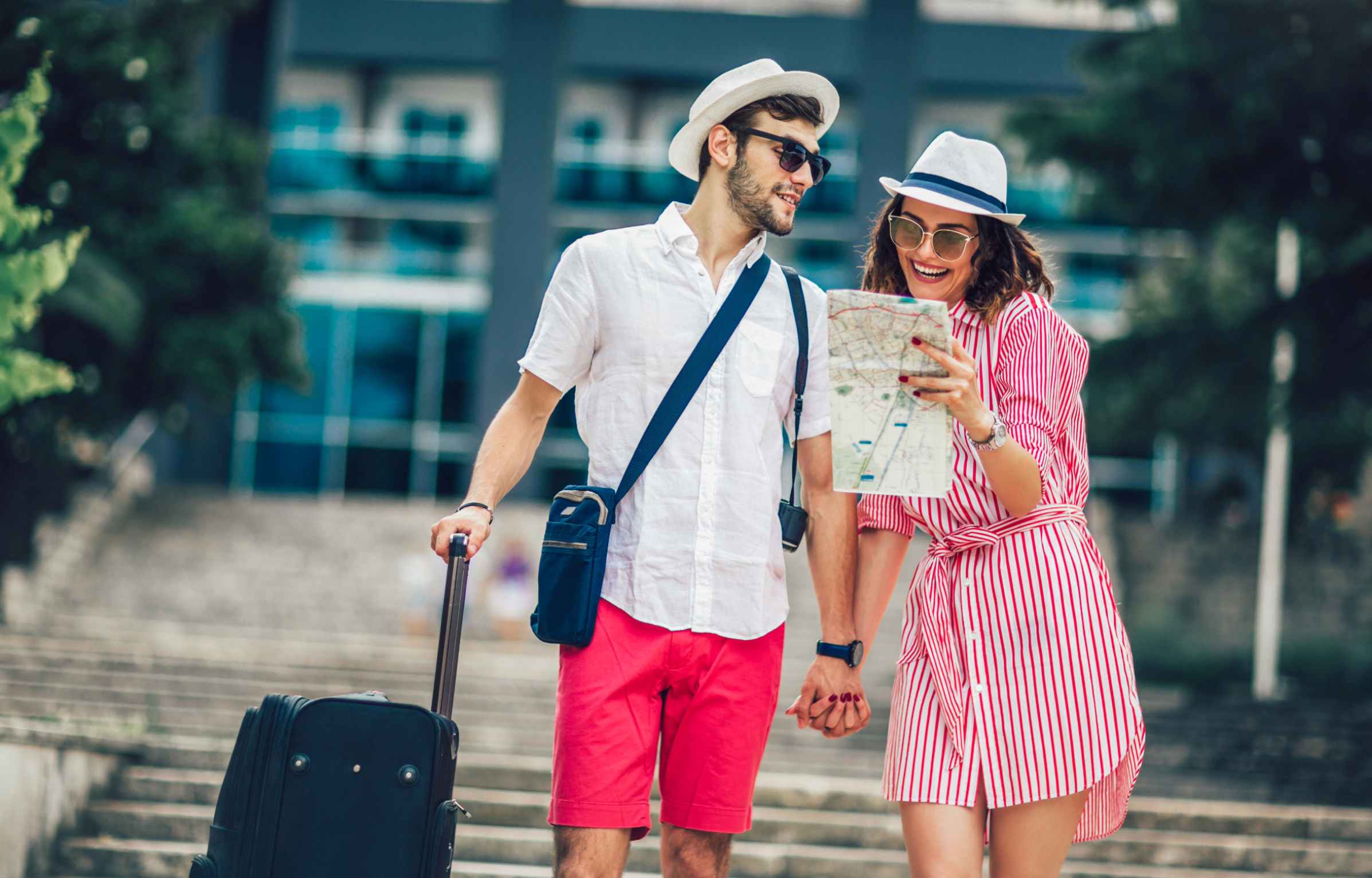 Happy Couple with Luggage and Map