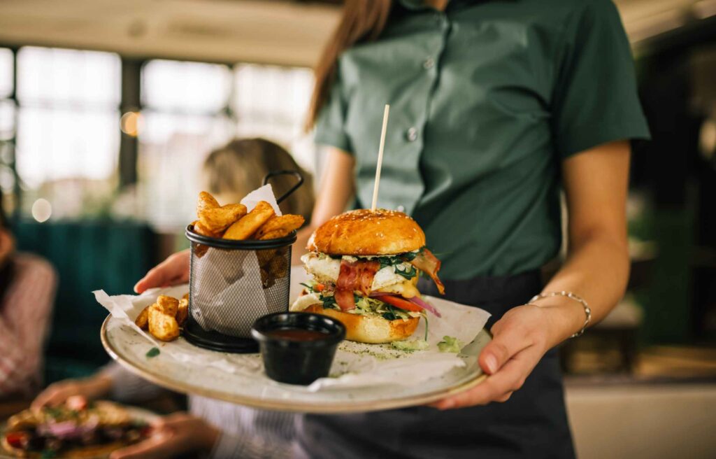 Women Serve Fries and Burger at Dining Lounge