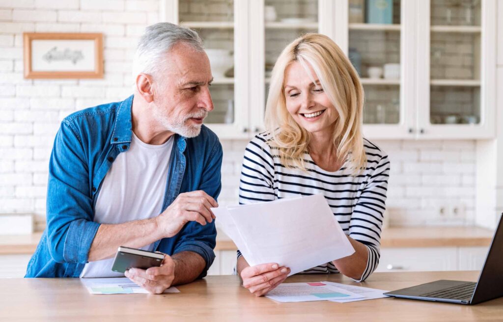 Aged Couple Filling Out Paperwork