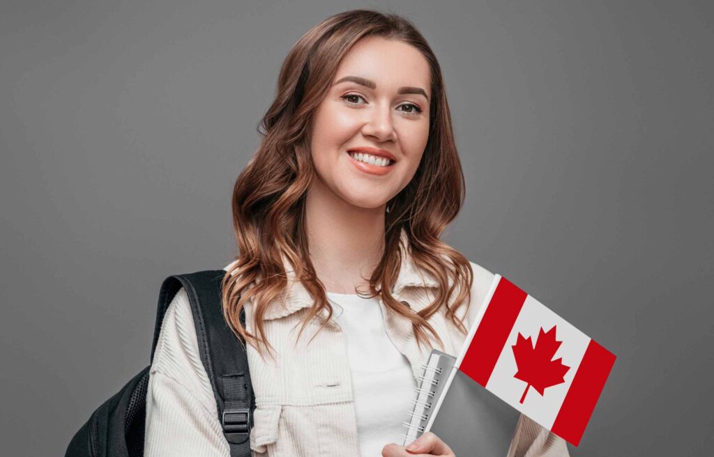 Smiling College Girl with holding Canada Flag