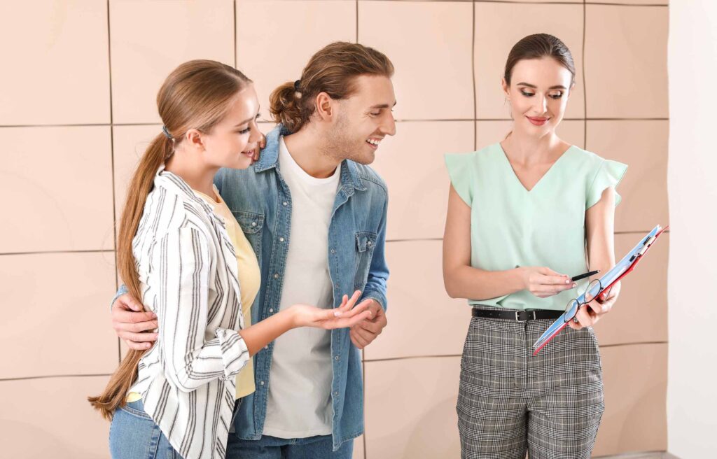 Job Relocation Consultant Showing Young Couple a New Corporate House