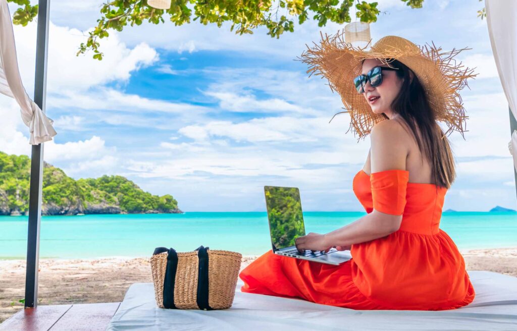 Traveler Asian woman relaxing at sea beach using laptop, Businesswoman on vacation at private resort, Attraction place tourist travel Phuket Thailand summer holiday, Tourism beautiful destination Asia