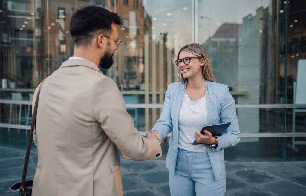 Two business people shaking hands