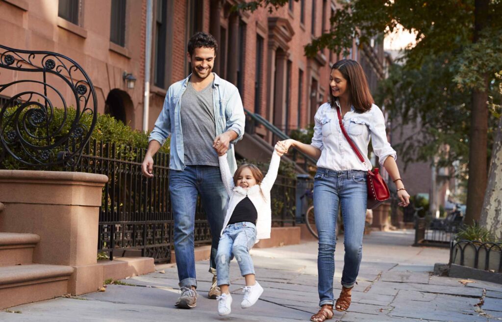 Family Taking a Walk down the Street
