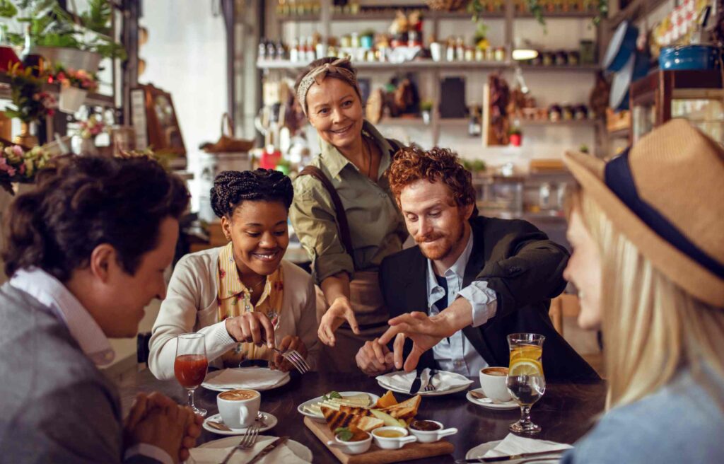 Friends dining at a hotel using the new chase sapphire reserve perks