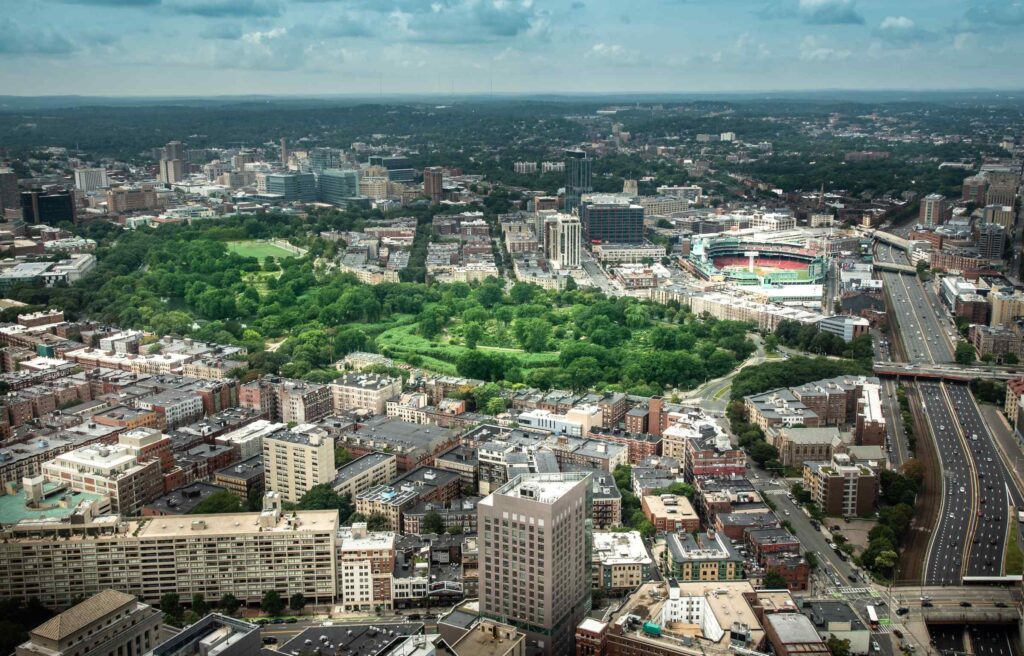 Aerial view of Fenway neighborhood with Fenway Park and surrounding city buildings in Boston.