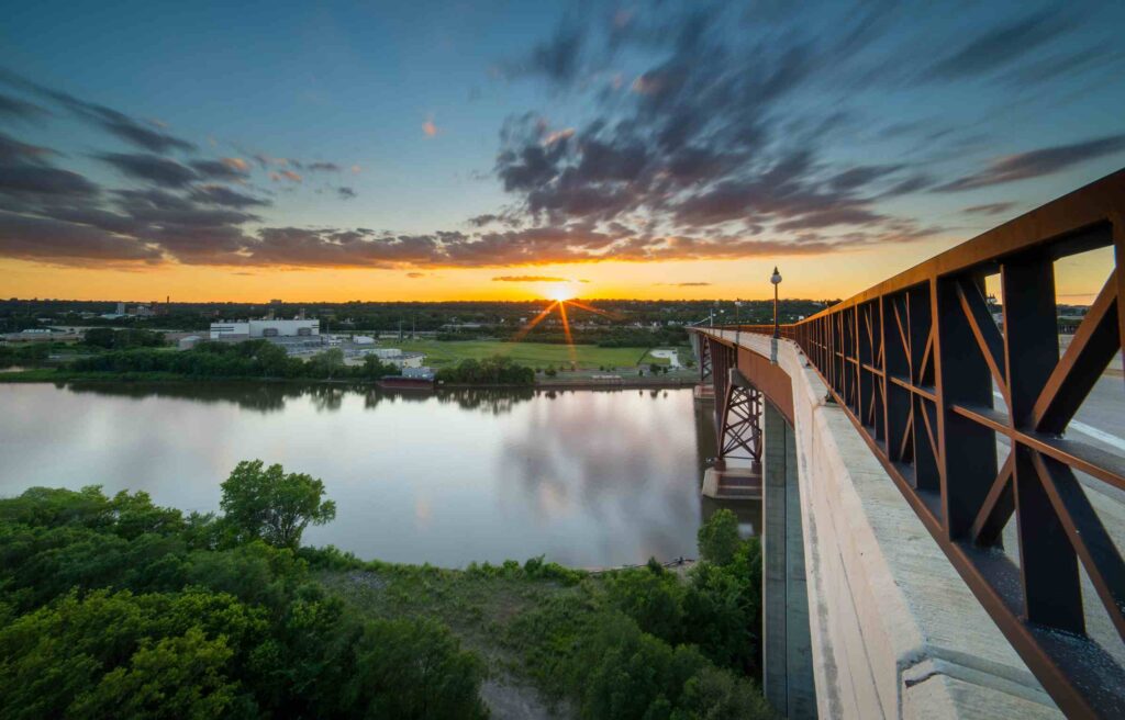Sunset view over the Mississippi River with a bridge leading into Minneapolis–St. Paul, Minnesota.