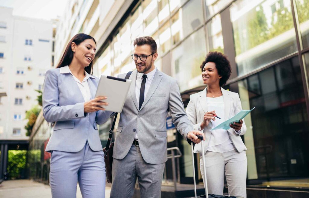 Young professionals in business attire walking through the city.