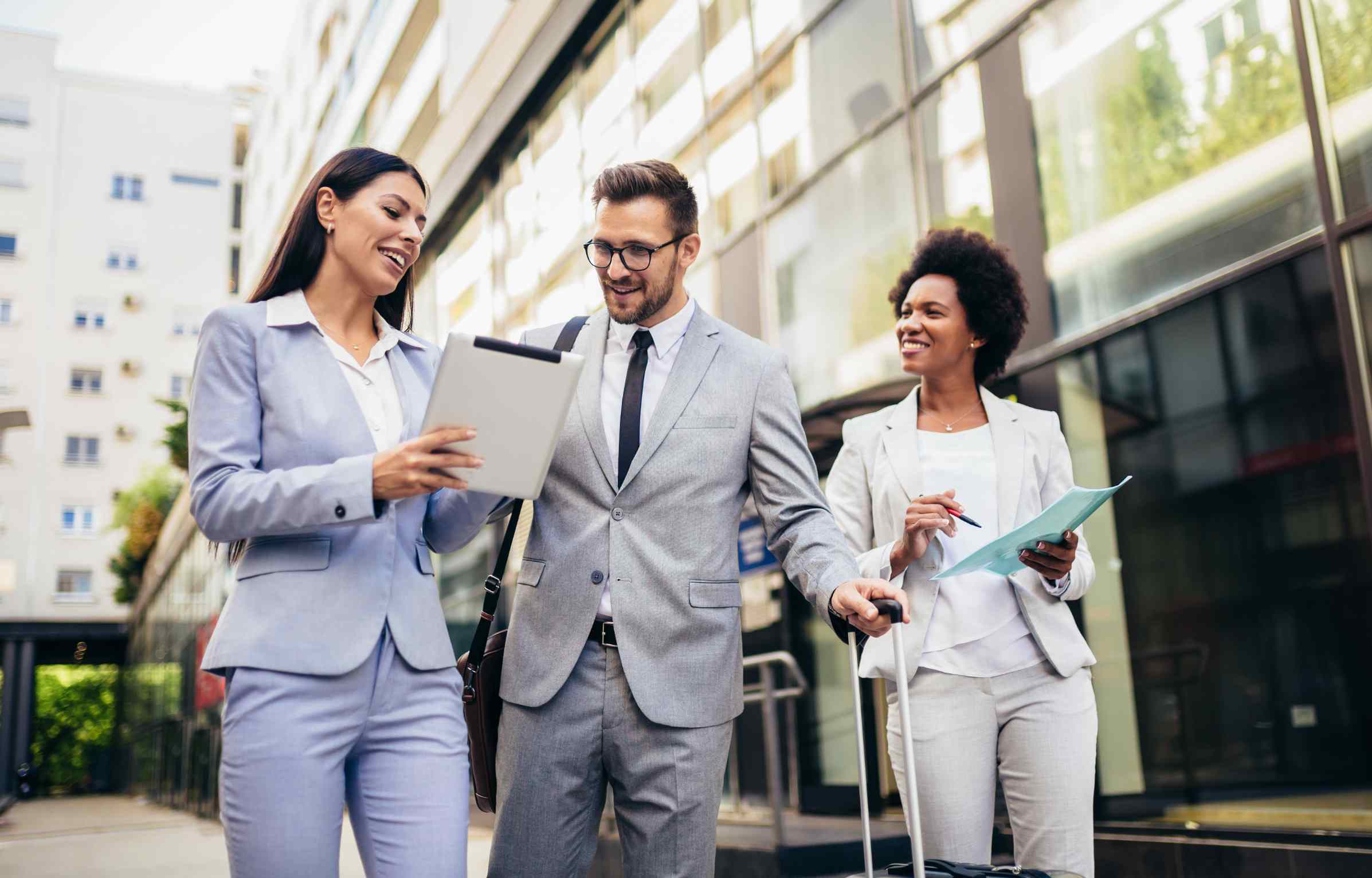 Young professionals in business attire walking through the city.