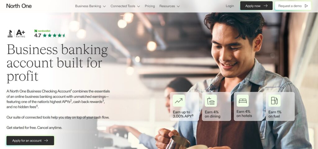 NorthOne homepage showcasing business banking account with high APY, cashback rewards, and connected tools, featuring a smiling small business owner.