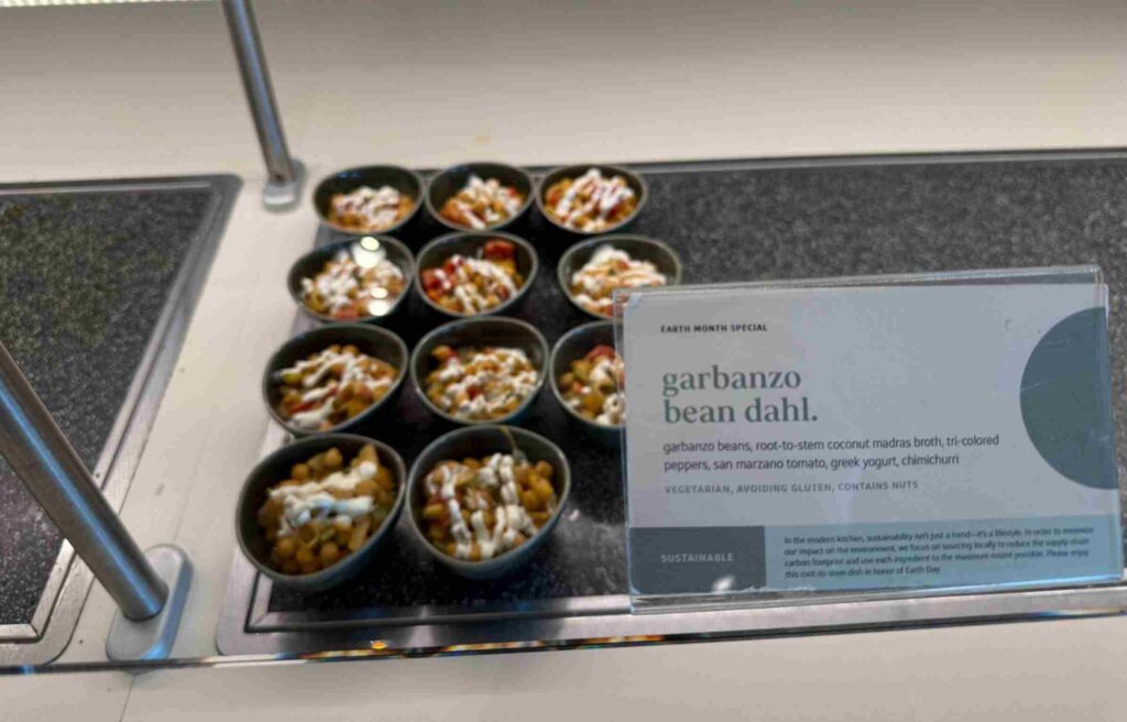Bowls of garbanzo bean dahl drizzled with yogurt and served for Earth Month at the Capital One Lounge.