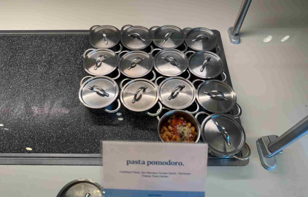 Individual servings of pasta pomodoro with tomato sauce and Parmesan cheese.
