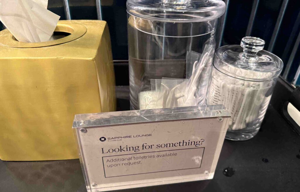 Toiletries and tissues neatly arranged at the Chase Sapphire Lounge.