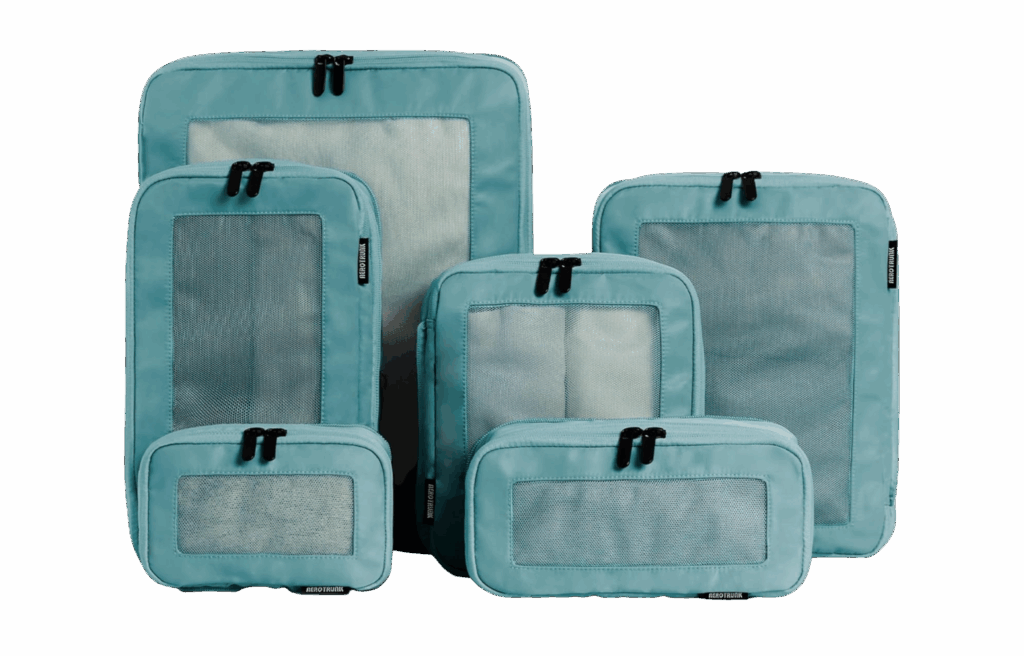 A set of five teal packing cubes in different sizes.
