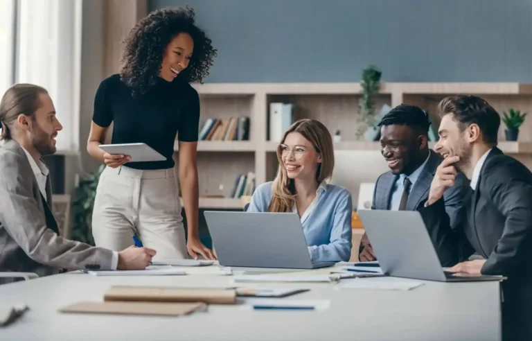 HR professionals reviewing moving expenses for job relocation during workforce planning.