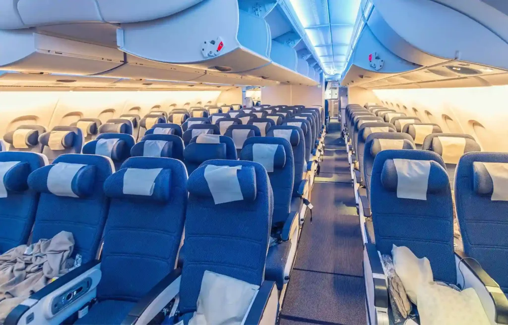 Alaska airlines lie flat seats cabin layout with rows of seats and spacious inflight interior design.