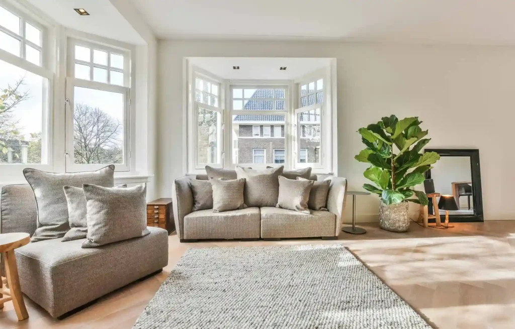 Bright furnished living room showing how to use credit card points for temporary housing.