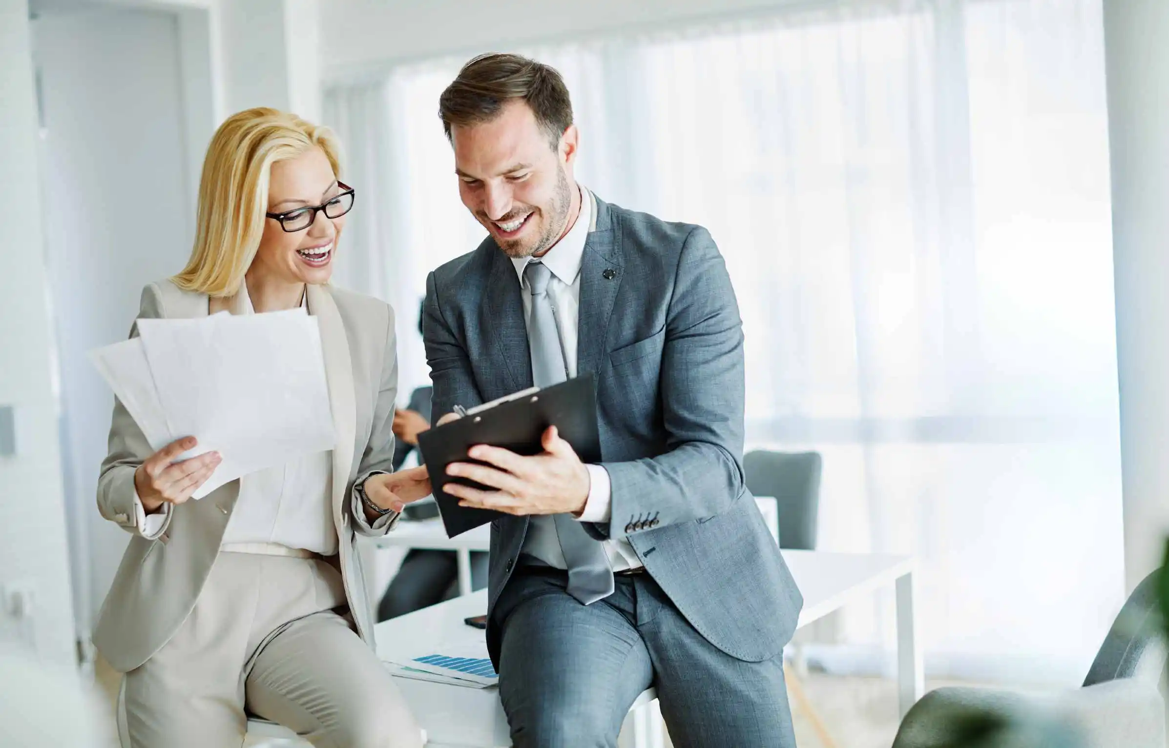 HR team reviewing employee relocation documents in a modern office.