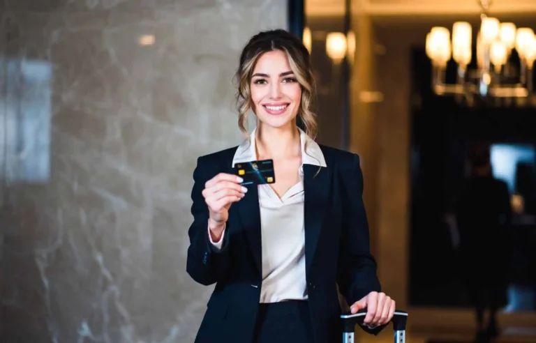 Hotel guest using a credit card at reception during an extended trip.