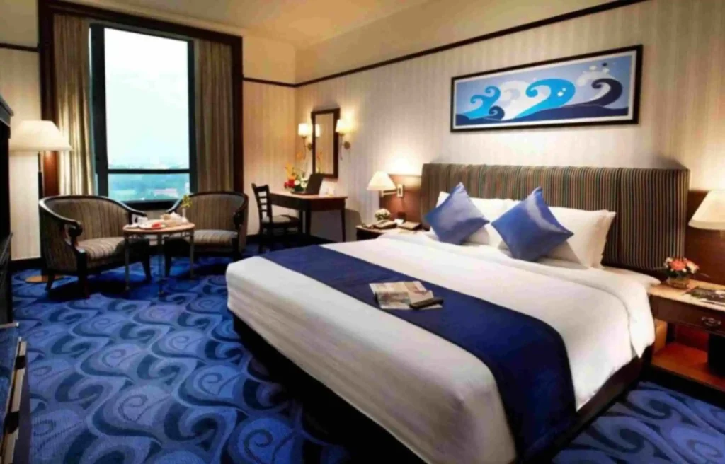 A luxury InterContinental hotel room interior, representing a high-value redemption secured using the IHG One Rewards 15% award discount promotion.