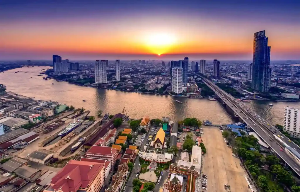 Bangkok skyline and Chao Phraya River at sunset, viewed from above