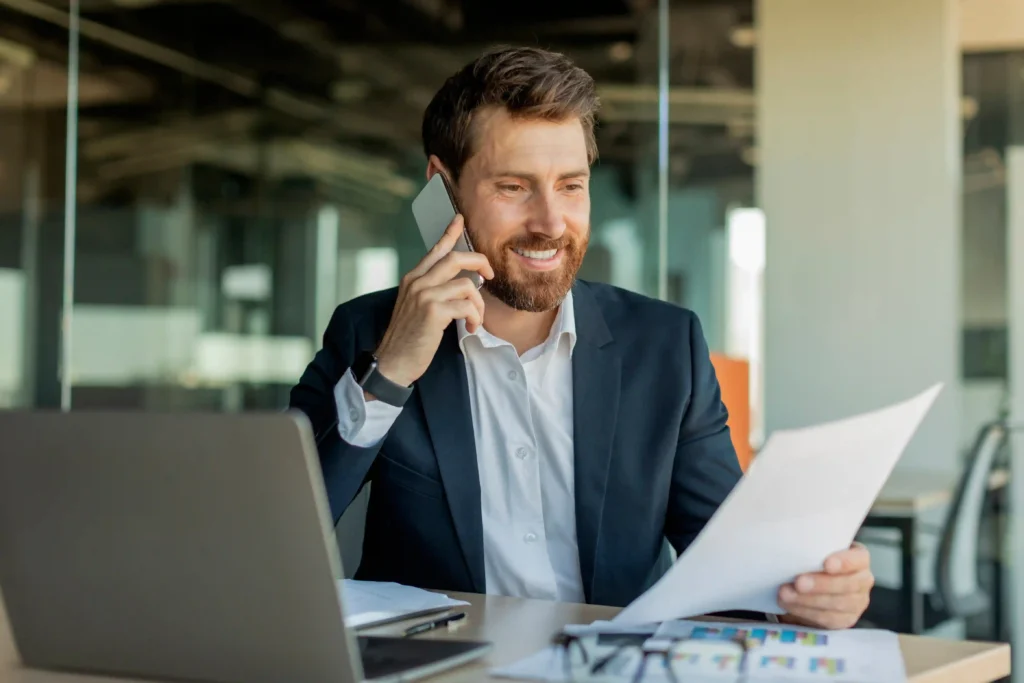 Business professional discussing a relocation package while reviewing documents.