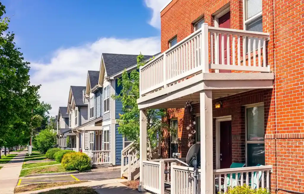 Denver townhomes along a sunny residential street, moving from san francisco to denver.