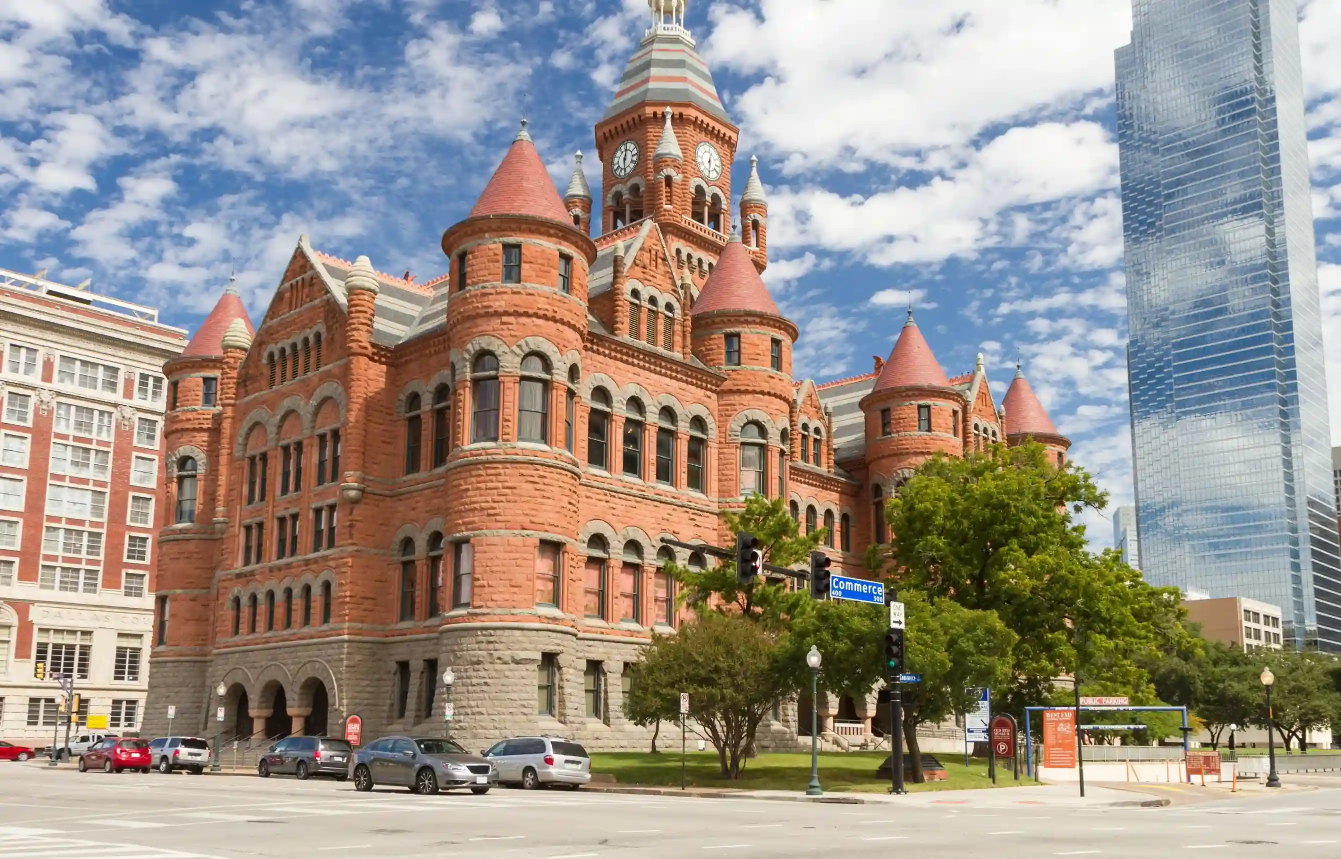 Historic Old Red Museum in downtown Dallas with modern skyscrapers in the background.