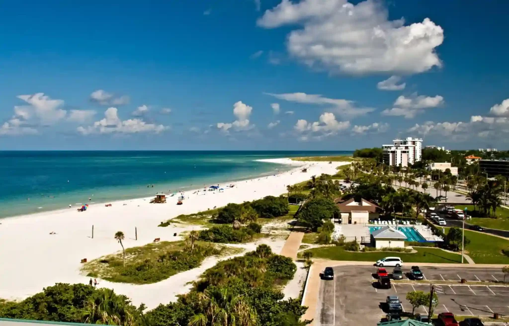 Sarasota, Florida white-sand beach and turquoise Gulf waters from above.