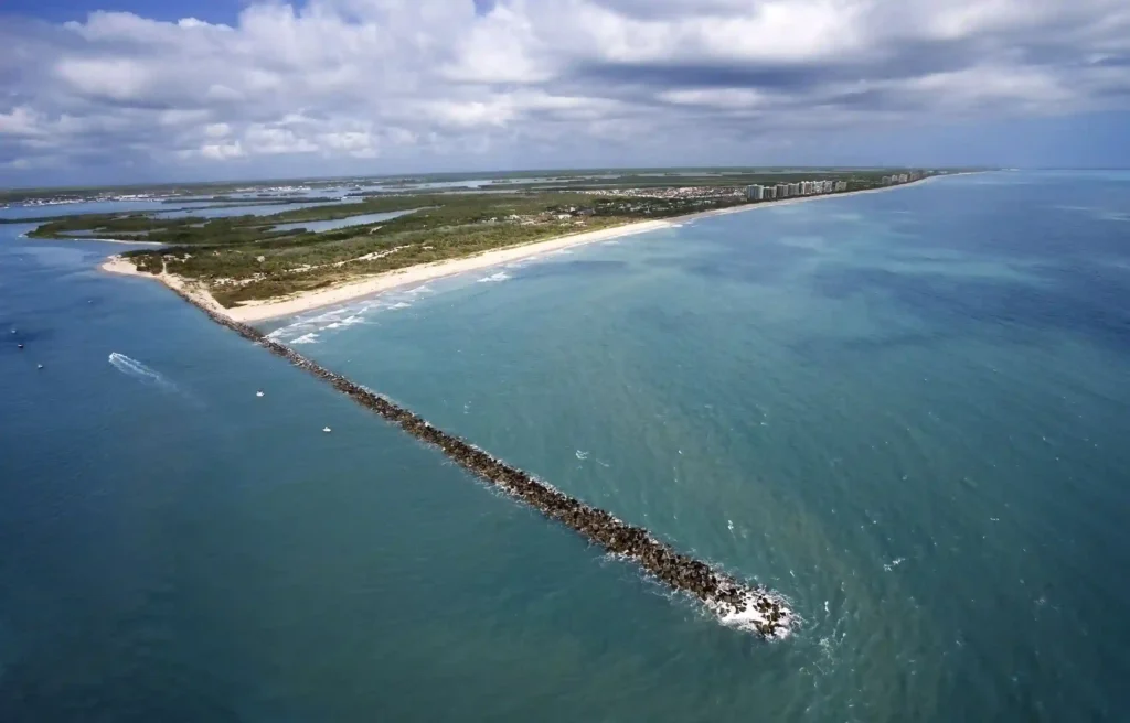 Fort Pierce, Florida aerial view of the coastline, inlet, beach, and turquoise Atlantic water.