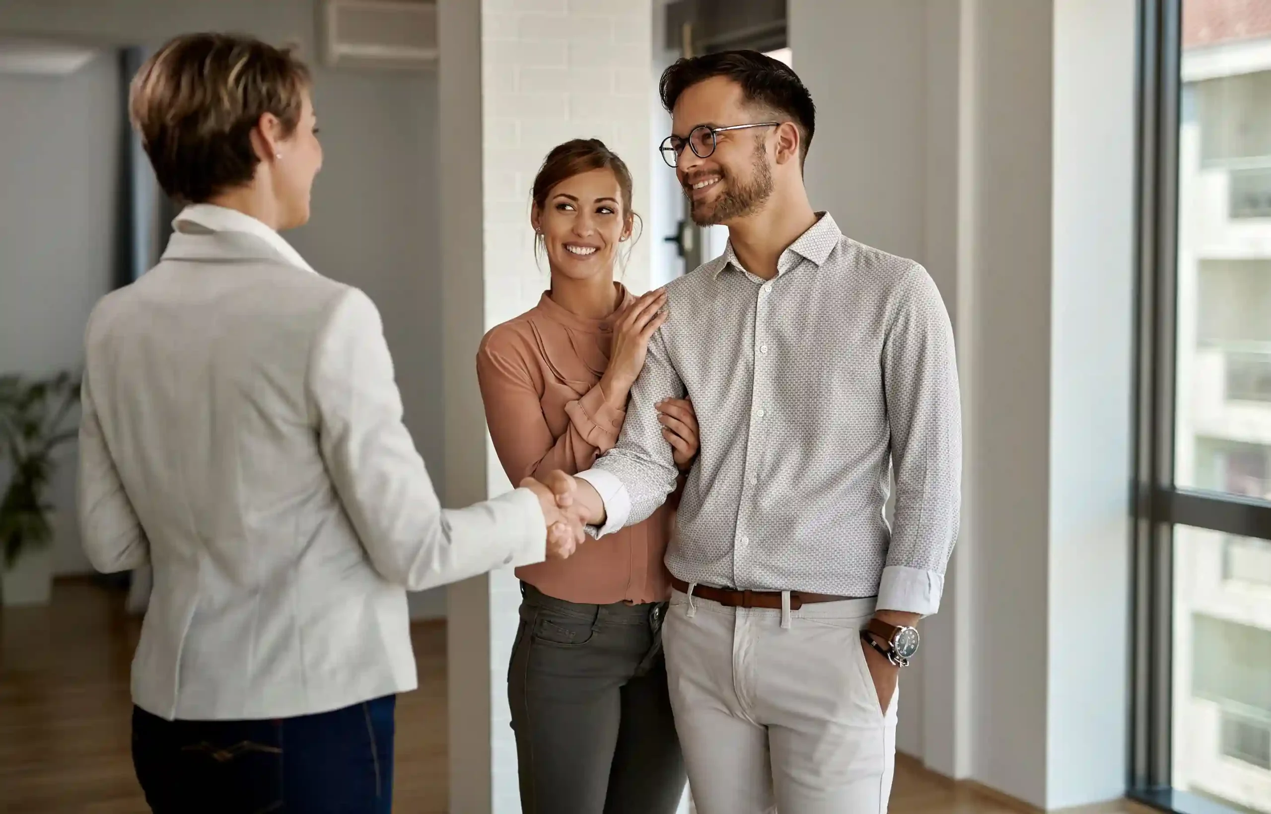 Couple meets with a relocation advisor to discuss family relocation assistance benefits and moving plans.