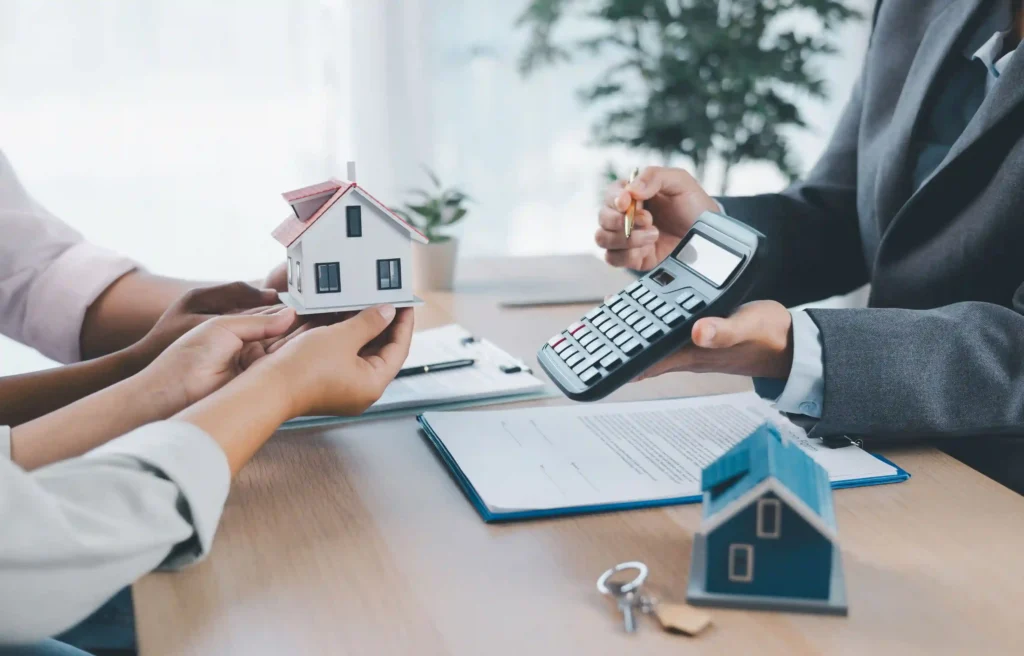 Homebuyer meeting with an agent reviewing mortgage rate lock documents and property financing details.